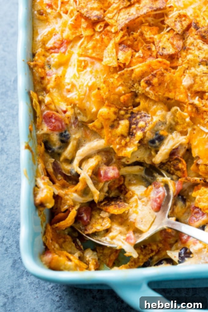 Cheesy Dorito Chicken Casserole, a delightful blend of cheesy, creamy, spicy, and crunchy textures.