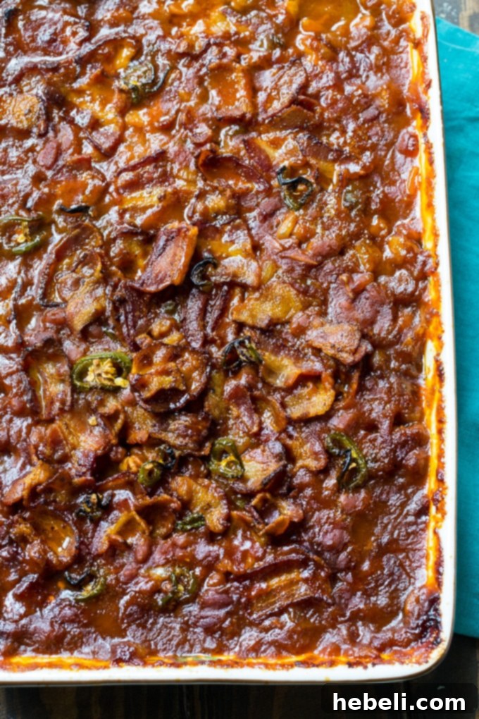Spicy Bacon Baked Beans baked in a 9x13-inch pan