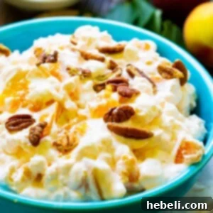 Millionaire Peach Salad in a blue bowl, presented beautifully.