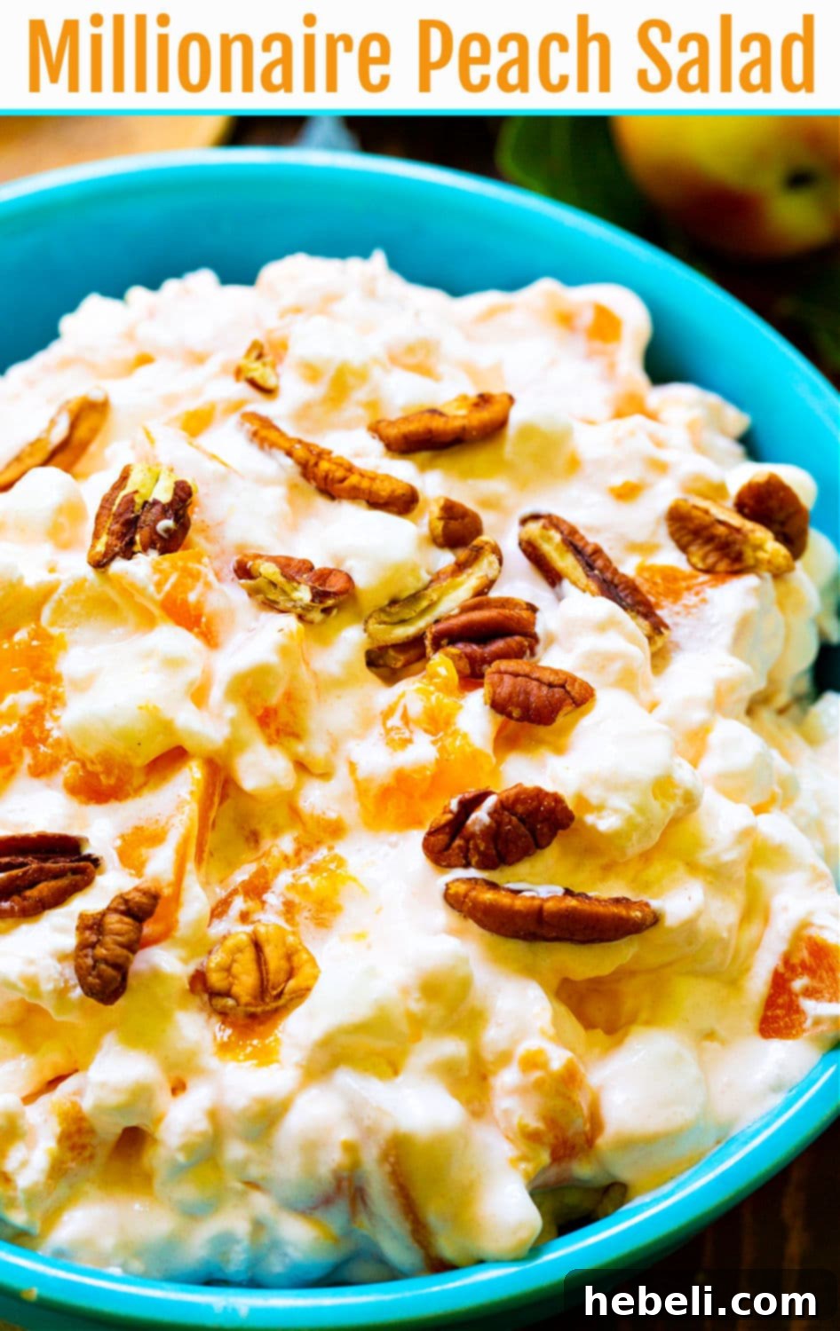 Golden Peach Ambrosia 11 A beautifully presented bowl of Millionaire Peach Salad, with its creamy texture and visible peach pieces, ready to be enjoyed as a perfect dessert.