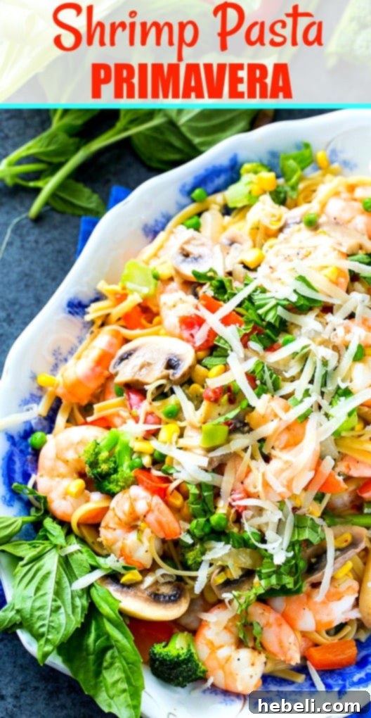 Spring's Bounty Shrimp Pasta 5 Shrimp Primavera on a serving plate with fresh basil garnish, ready to be enjoyed.