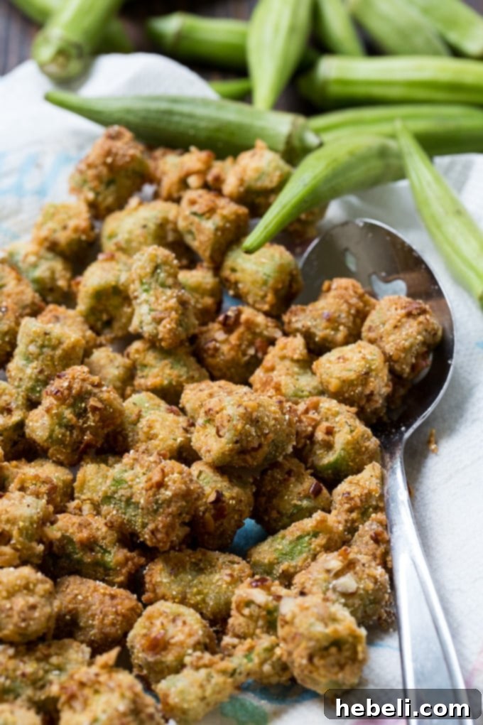 Freshly fried Pecan Crusted Fried Okra, stacked and ready to eat