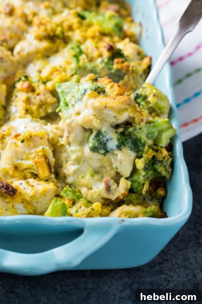 Hearty Cheesy Chicken Broccoli Bake 3 Close-up of the Cheesy Chicken and Broccoli Casserole mixture in a baking dish before baking, showing the chicken, broccoli, and cheese.