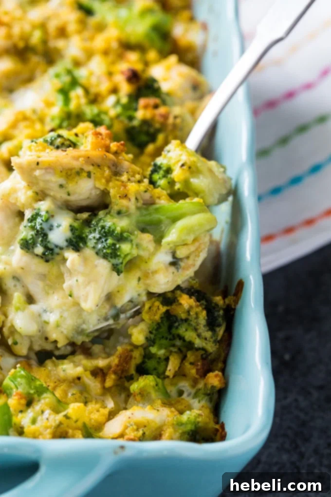 Hearty Cheesy Chicken Broccoli Bake 5 A serving of Cheesy Chicken and Broccoli Casserole on a plate, showing the creamy texture and golden stuffing.