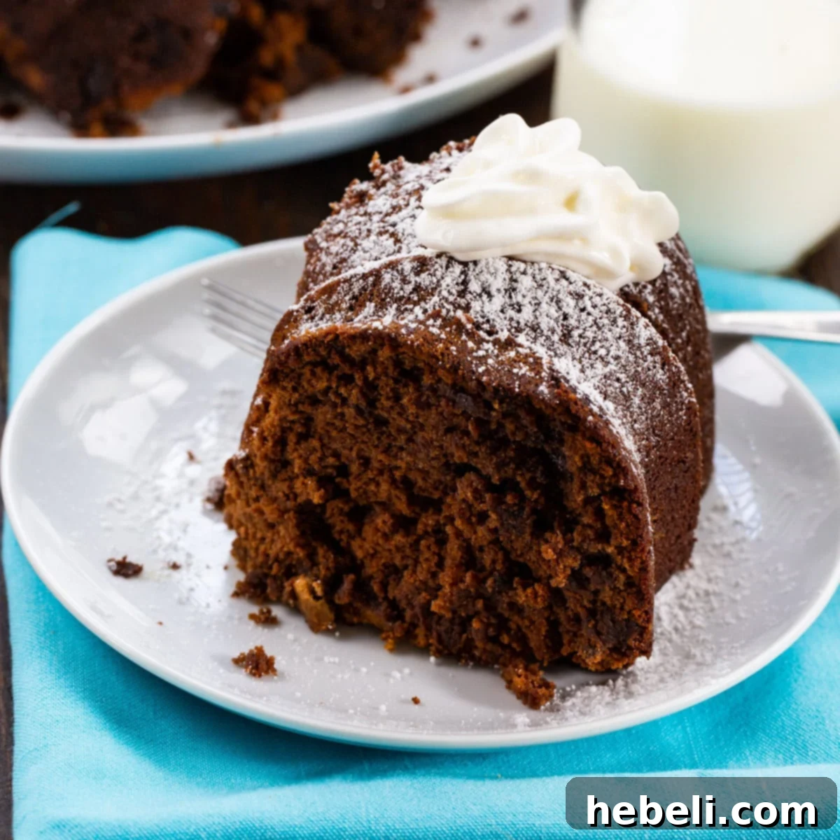 A perfectly sliced piece of Chocolate Cream Cheese Pound Cake, showcasing its dense, moist texture and deep chocolate color.