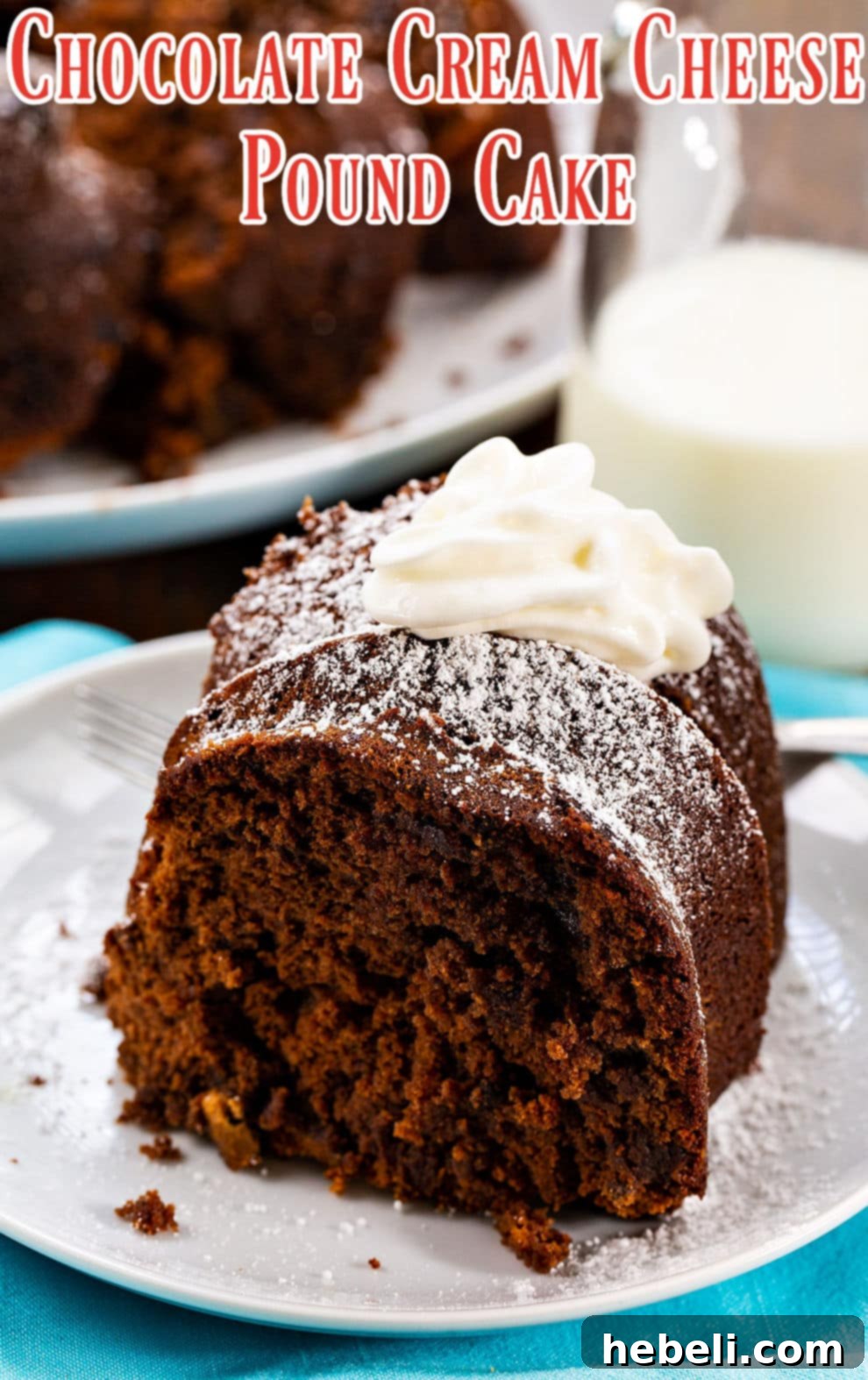 A decadent slice of Chocolate Cream Cheese Pound Cake topped with a generous swirl of whipped cream, ready to be enjoyed.