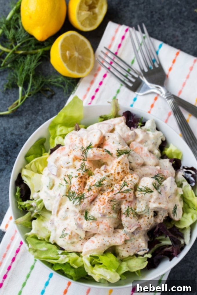 Close-up of Southern Shrimp Salad in a bowl, garnished with fresh dill