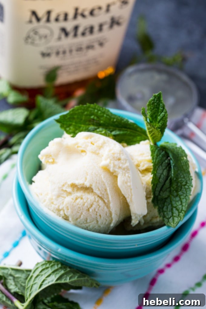 Freshly churned Mint Julep Ice Cream in a freezer-safe container.
