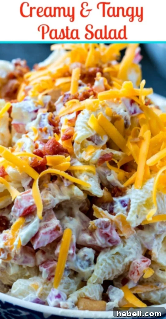 Creamy Tangy Pasta Salad 6 Creamy and Tangy Pasta Salad with bacon and cheddar cheese, served in a decorative bowl