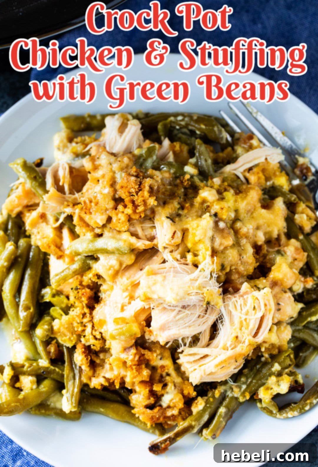 A generous serving of Crock Pot Chicken and Stuffing with Green Beans on a white plate, highlighting the comforting texture and appealing presentation.