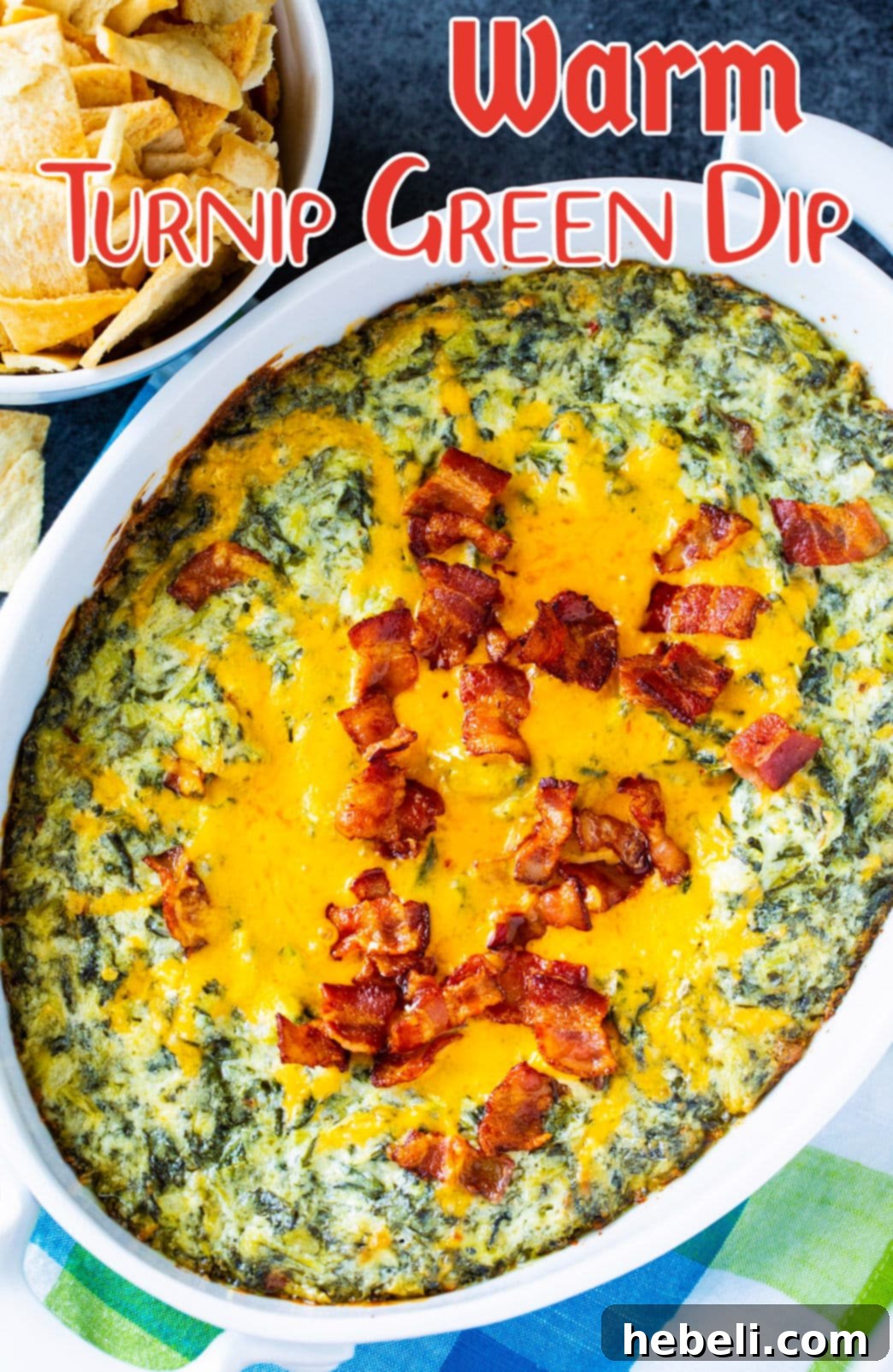 Overhead view of a baking dish filled with Warm Turnip Green Dip, golden brown and garnished, ready to be served.