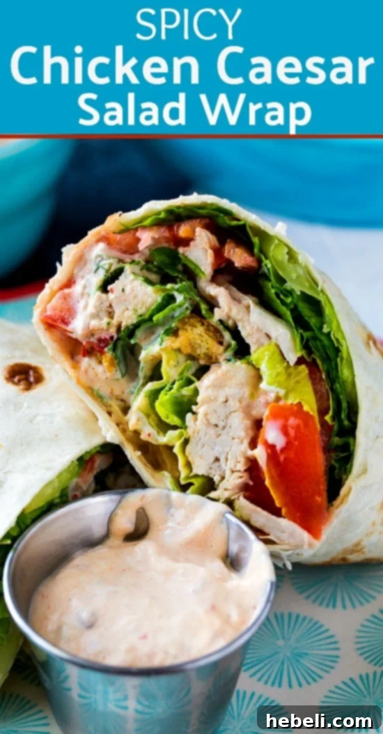 A beautifully presented Spicy Chicken Caesar Salad Wrap, highlighting its fresh ingredients and perfect roll.