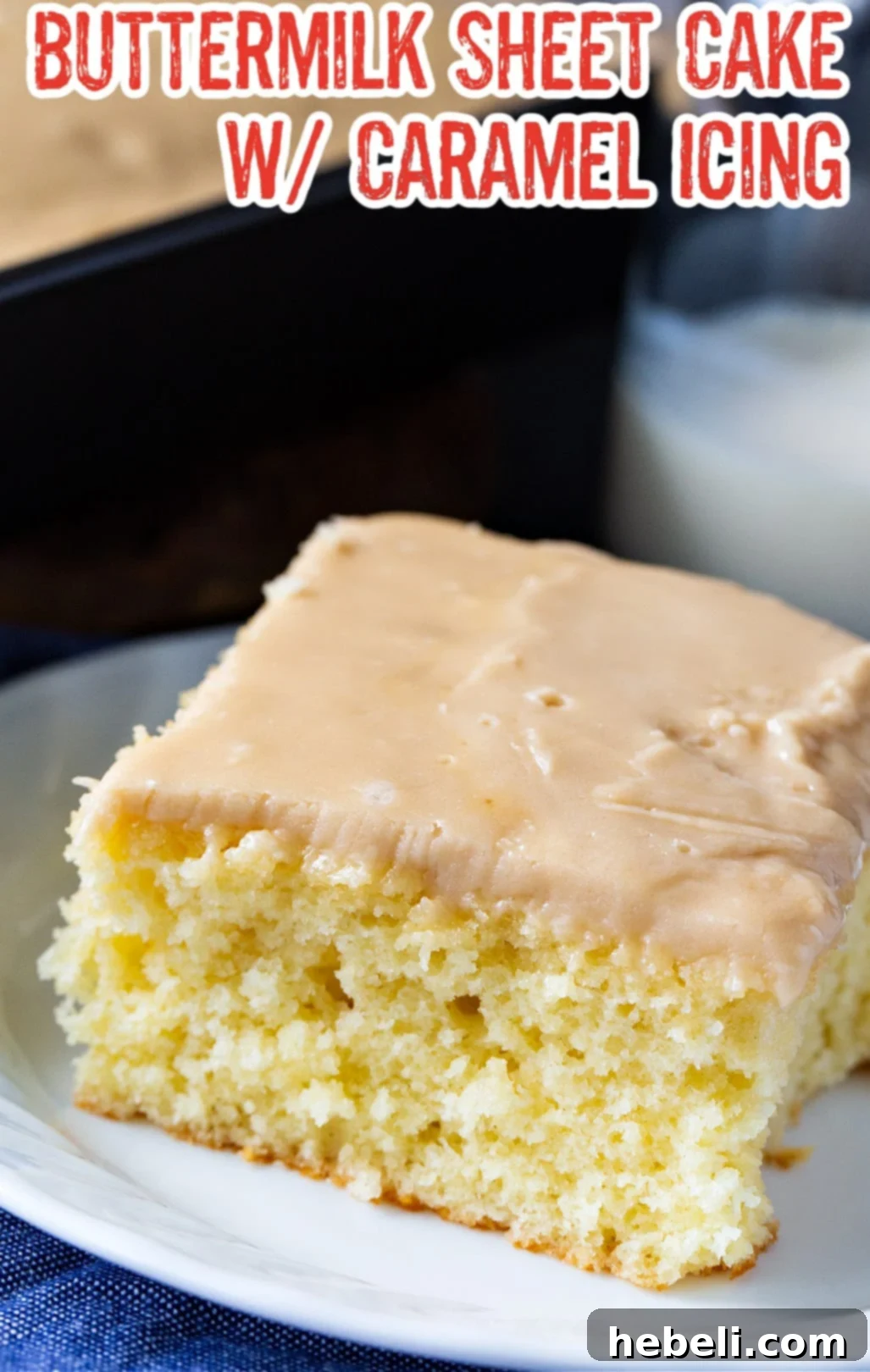 A pristine slice of Buttermilk Sheet Cake with Caramel Icing, highlighting the soft cake and glistening caramel.