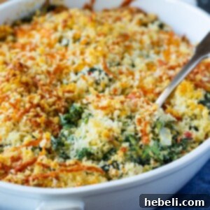 Southern Pimento Cheese Creamed Spinach 5 Spoon scooping Pimento Cheese Creamed Spinach.
