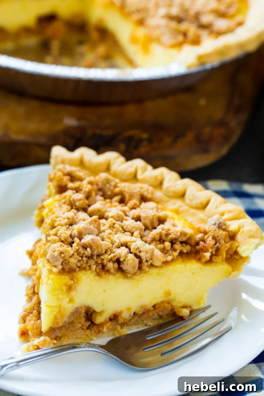 Close-up of a slice of Peanut Butter Pie, highlighting the creamy custard and crunchy layers.