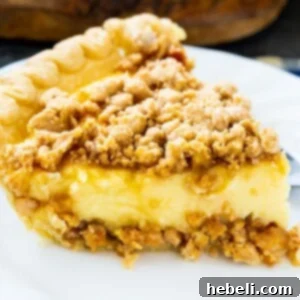 Slice of Peanut Butter Crunch Pie on a plate.