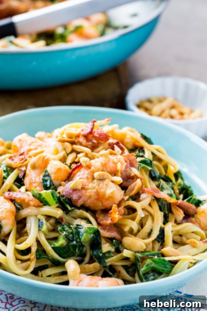 Cooking collard greens and garlic in a skillet with savory bacon grease