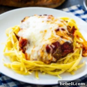 Thumbnail of Italian Cubed Beef over spaghetti on a white plate.