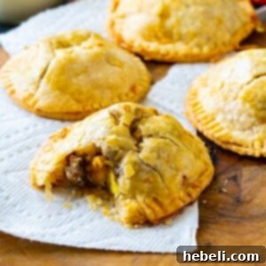 Finished Sausage, Egg, and Cheese Hand Pies on a wooden board