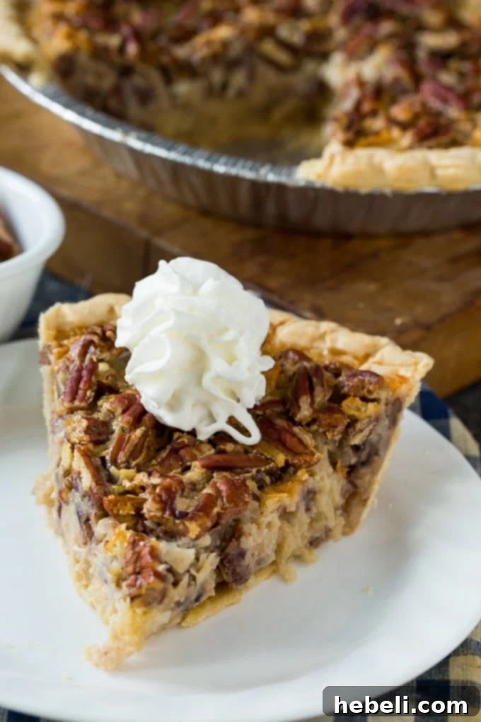 A close-up of Cream of Coconut Pecan Pie, showcasing its rich, golden-brown crust and the inviting texture of the filling with visible pecans and coconut.