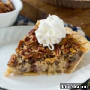 A whole Cream of Coconut Pecan Pie, perfectly baked with a golden crust and a rich, inviting filling.