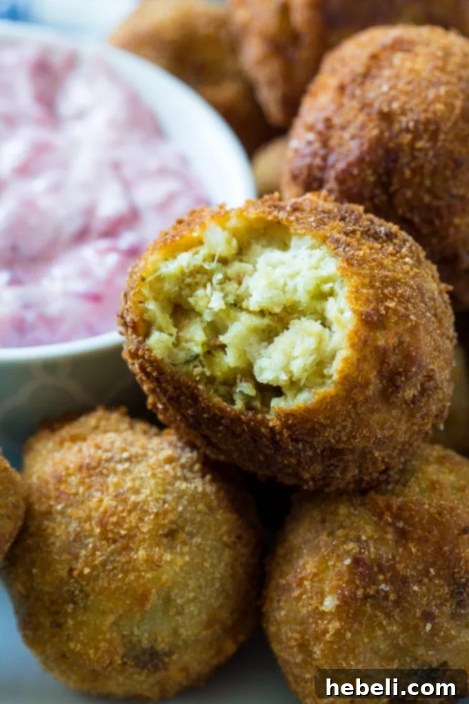 A beautifully arranged platter of golden Deep-Fried Stuffing balls, invitingly ready to be enjoyed.