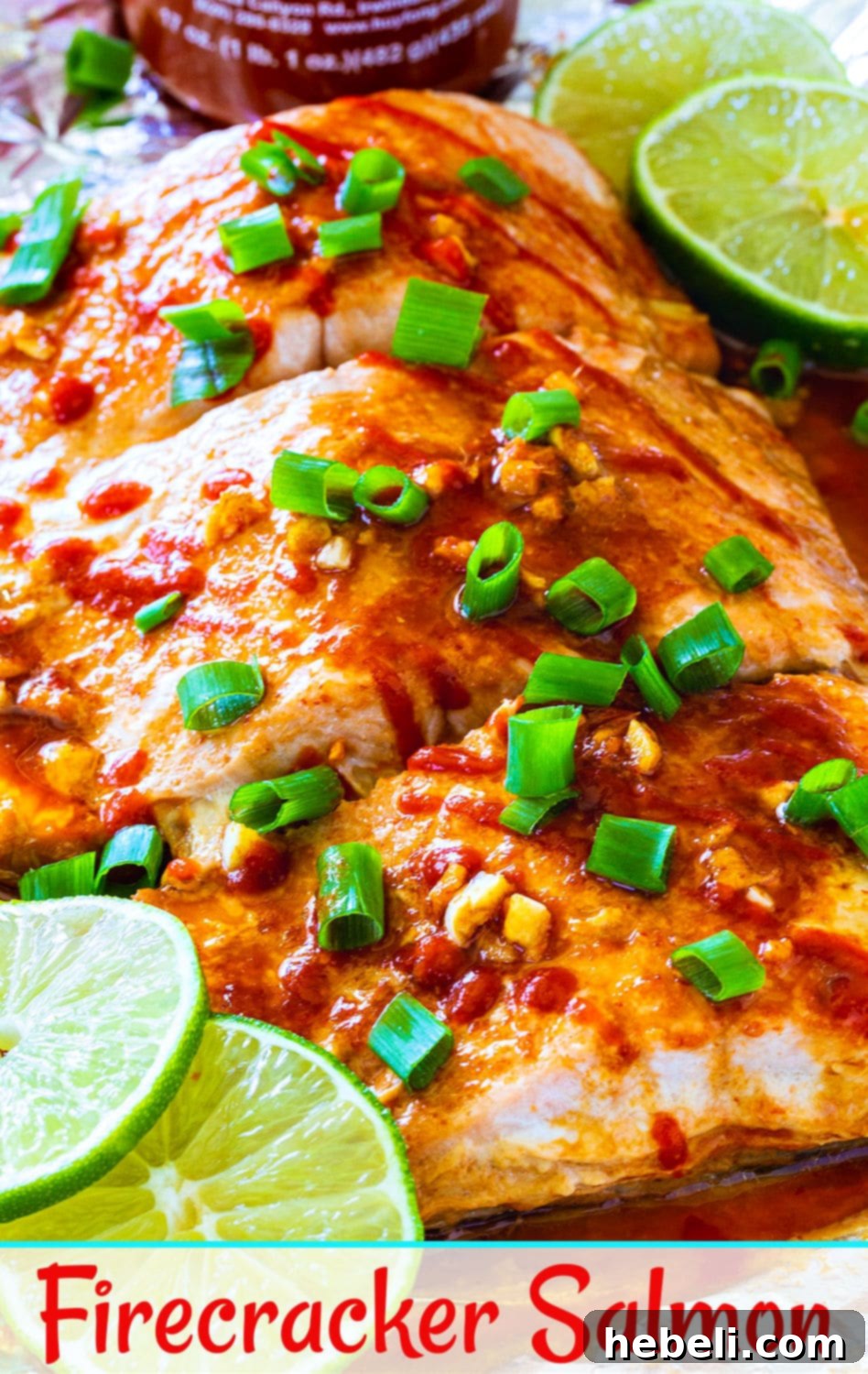 A stunning close-up of a Firecracker Baked Salmon fillet, glistening with its spicy glaze and ready to eat.