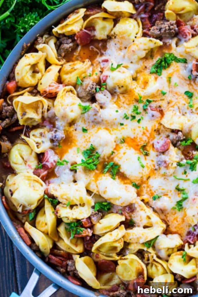 One Pot Meaty Tortellini with ground beef and pepperoni, showcasing rich texture