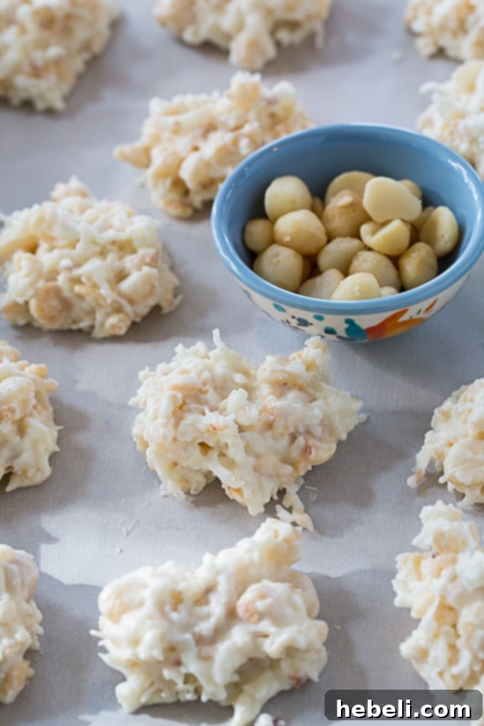 Tropical White Chocolate Macadamia Coconut Delights 3 Close-up of White Chocolate Coconut Macadamia Clusters showcasing their texture