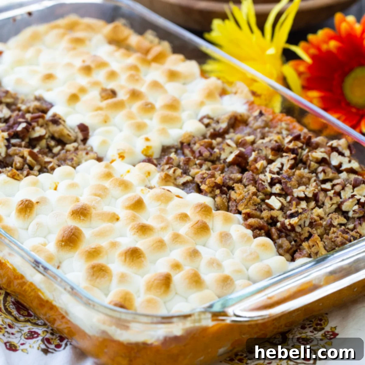 Sweet Potato Casserole covered partly with marshmallows and partially with pecans, showcasing the 'have it both ways' concept.
