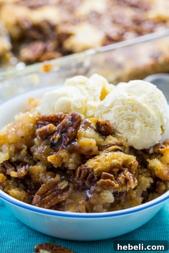 Pecan Pie Cobbler batter being spooned into a pan over melted butter, before adding toppings.