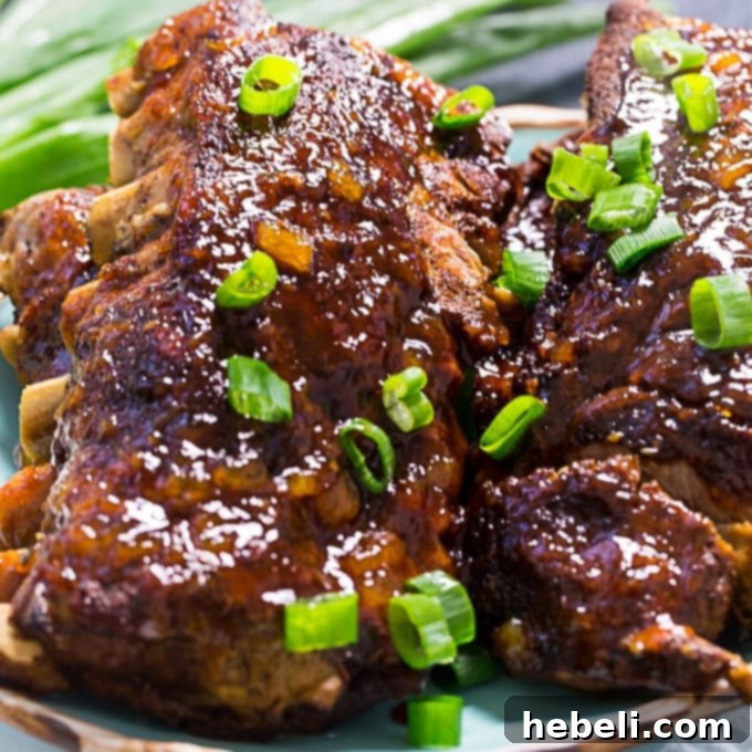 Delicious Crock Pot Hawaiian Ribs glazed with pineapple teriyaki sauce, ready to serve.