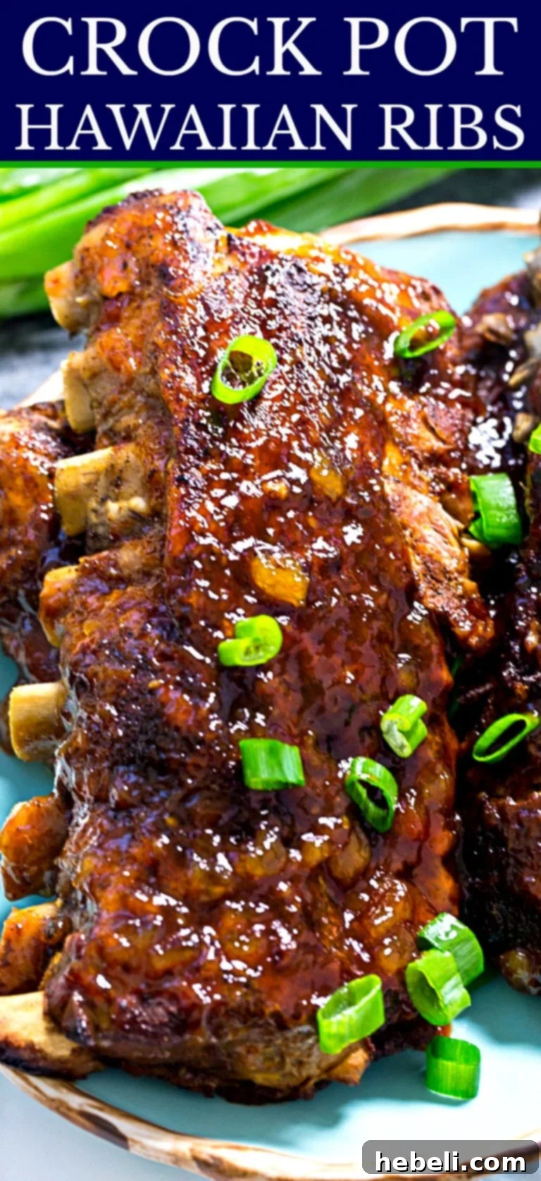Platter of Crock Pot Hawaiian Ribs garnished with fresh green onions, ready for a delicious feast.