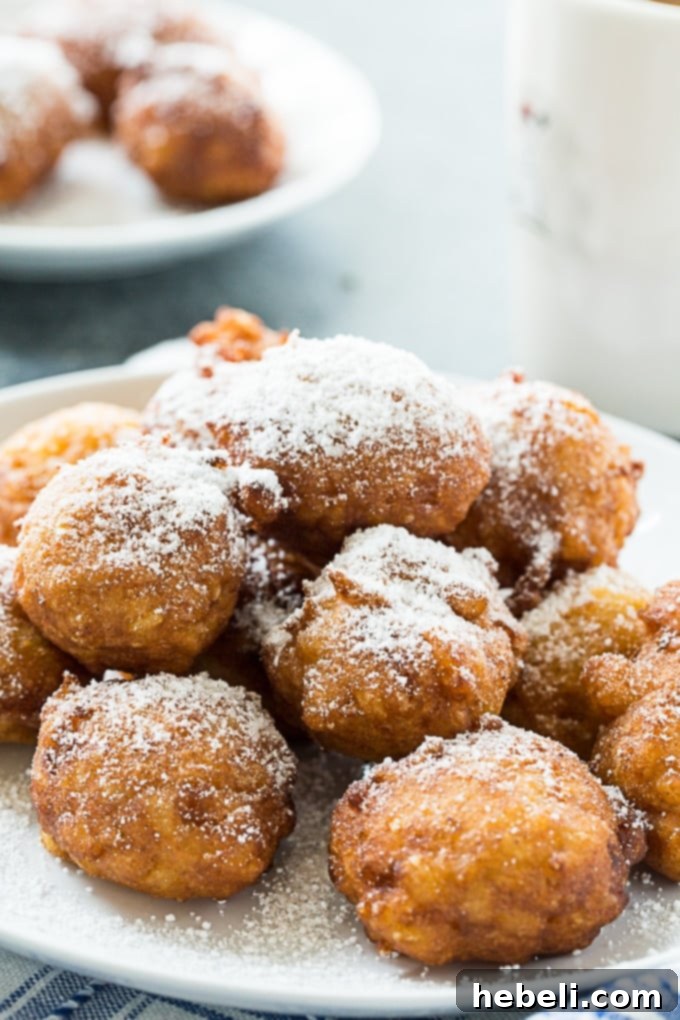 Sweet Calas served fresh with powdered sugar for a delightful dessert