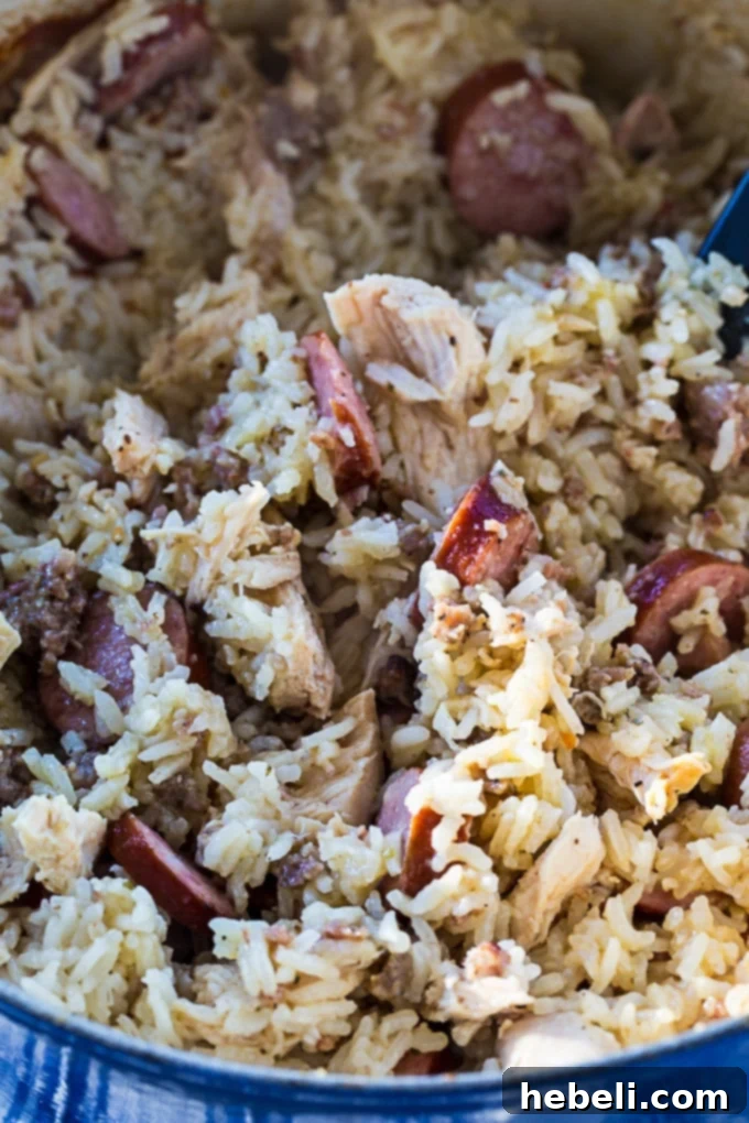 A serving of Creamy Chicken Bog with a spoon, highlighting its comforting and hearty nature.