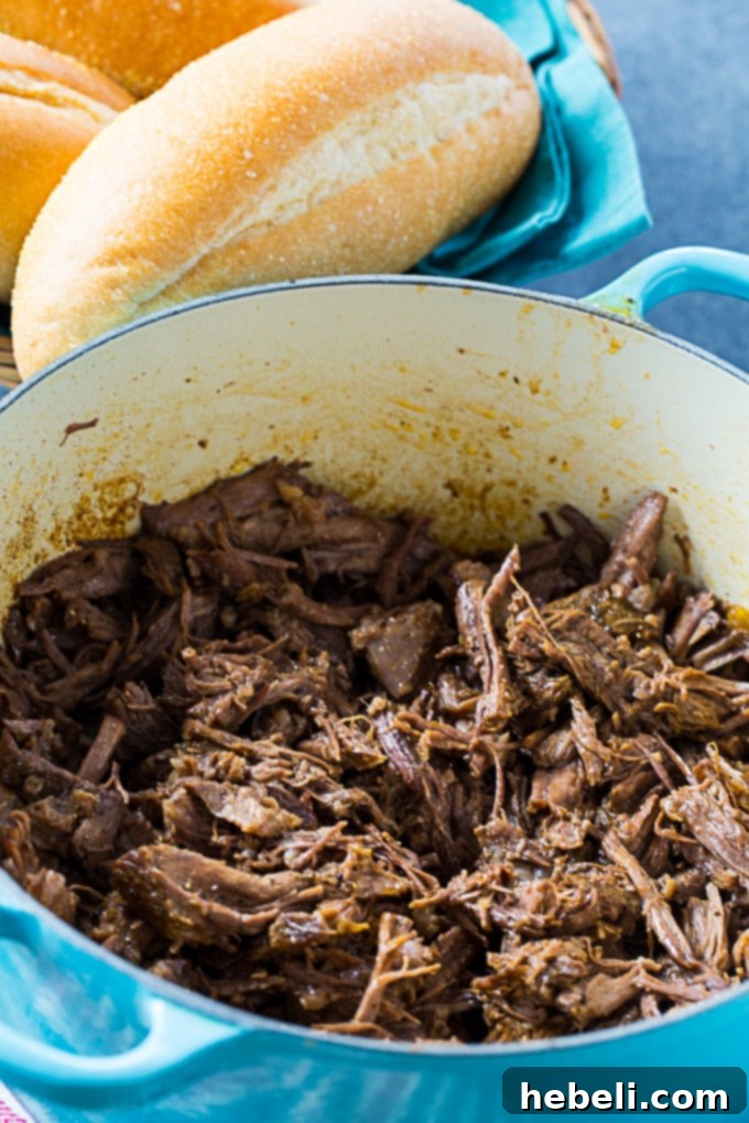 Slow-Roasted Beef Shreds 3 Roast Beef Debris with gravy, ready for a Po Boy
