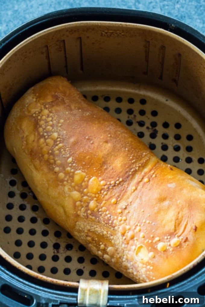 Easy Air Fryer Pepperoni and Peppers Stromboli 3 Close-up of the delicious filling for Air Fryer Pepperoni and Peppers Stromboli