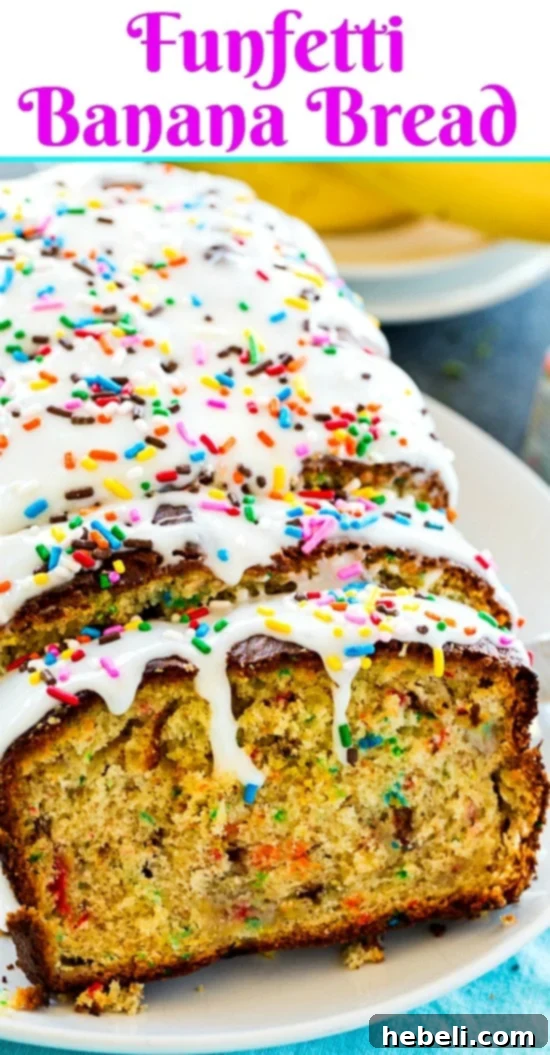 A vibrant, fluffy loaf of Funfetti Banana Bread, garnished with colorful sprinkles.