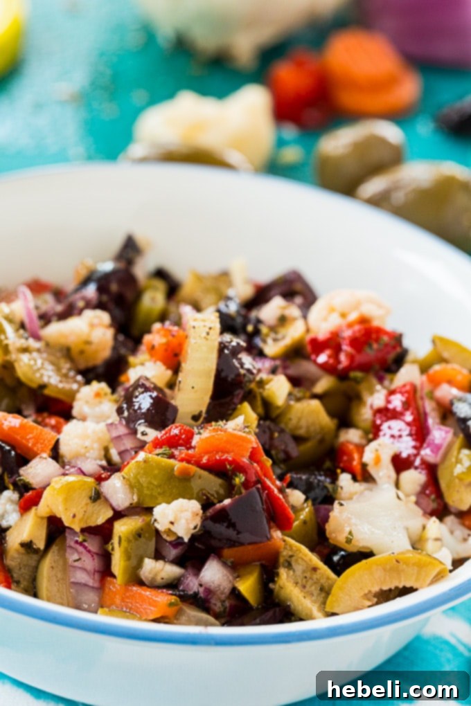 Olive Salad, perfect for layering on Muffaletta sandwiches or as a versatile condiment.