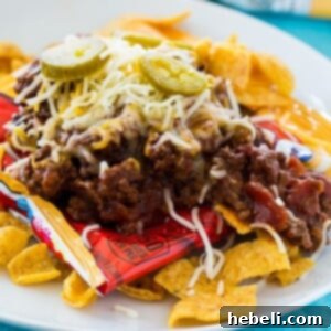 bag of fritos topped with chili, recipe image