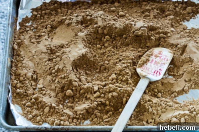 Gumbo in 30 Minutes 4 Flour baking in the oven for a dark roux, a key component of a quick 30-Minute Gumbo recipe.