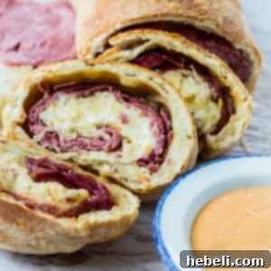 Crispy Air Fryer Reuben Stromboli 6 Stromboli with Reuben fillings, a close up of the sliced crispy dough