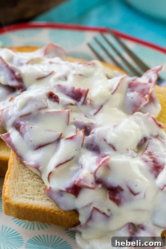 Savory Creamed Beef 4 Creamed Chipped Beef simmering in a skillet