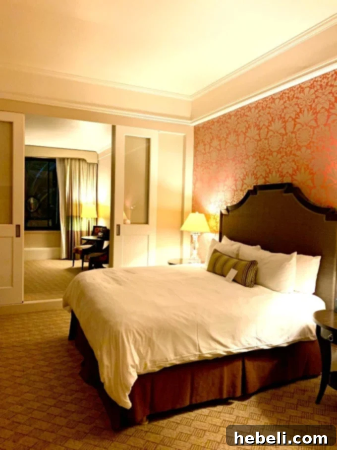 Luxurious Royal Hawaiian Suite interior with elegant decor, a comfortable bed, and ample living space