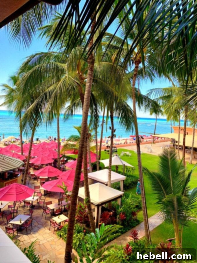 Interior view of a well-appointed room at The Royal Hawaiian with elegant furnishings and a view towards the window