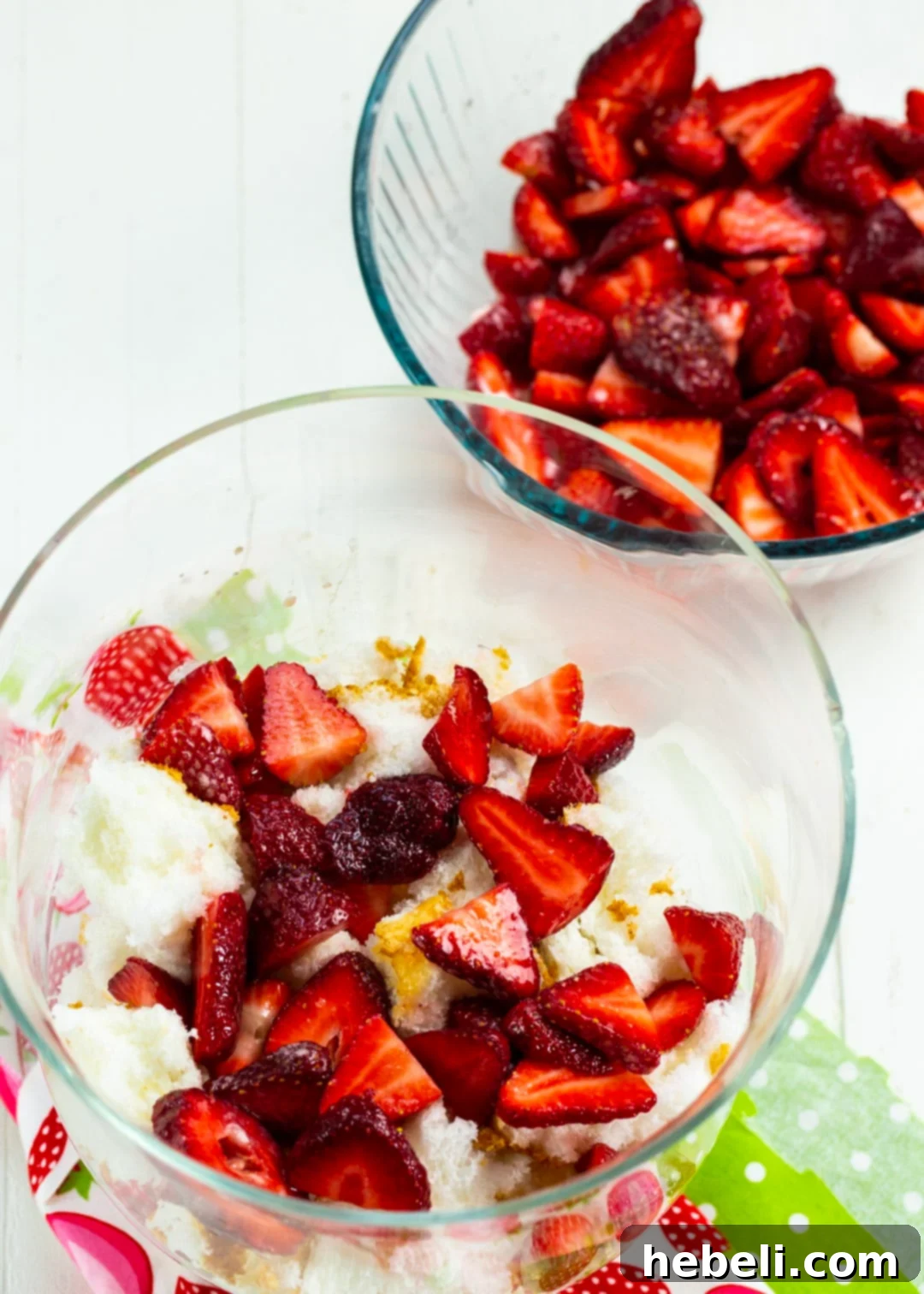 Velvet Amaretto Strawberry Trifle 4 Fresh, juicy strawberries, glistening with their macerated juices, beautifully layered on top of Angel Food Cake pieces within a clear trifle bowl.