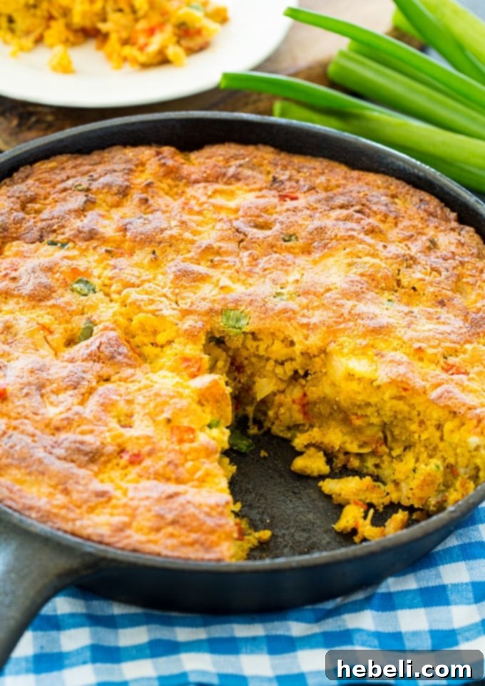 Crawfish Cornbread baked in a traditional cast iron pan, showing the rustic charm