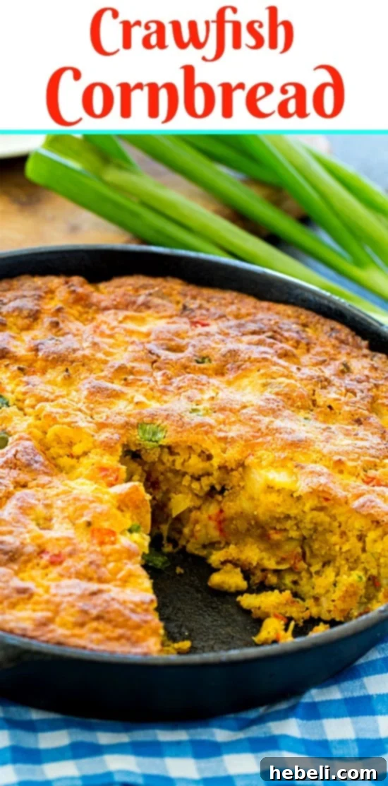 Large, delicious Crawfish Cornbread with a serving spoon, ready for a gathering