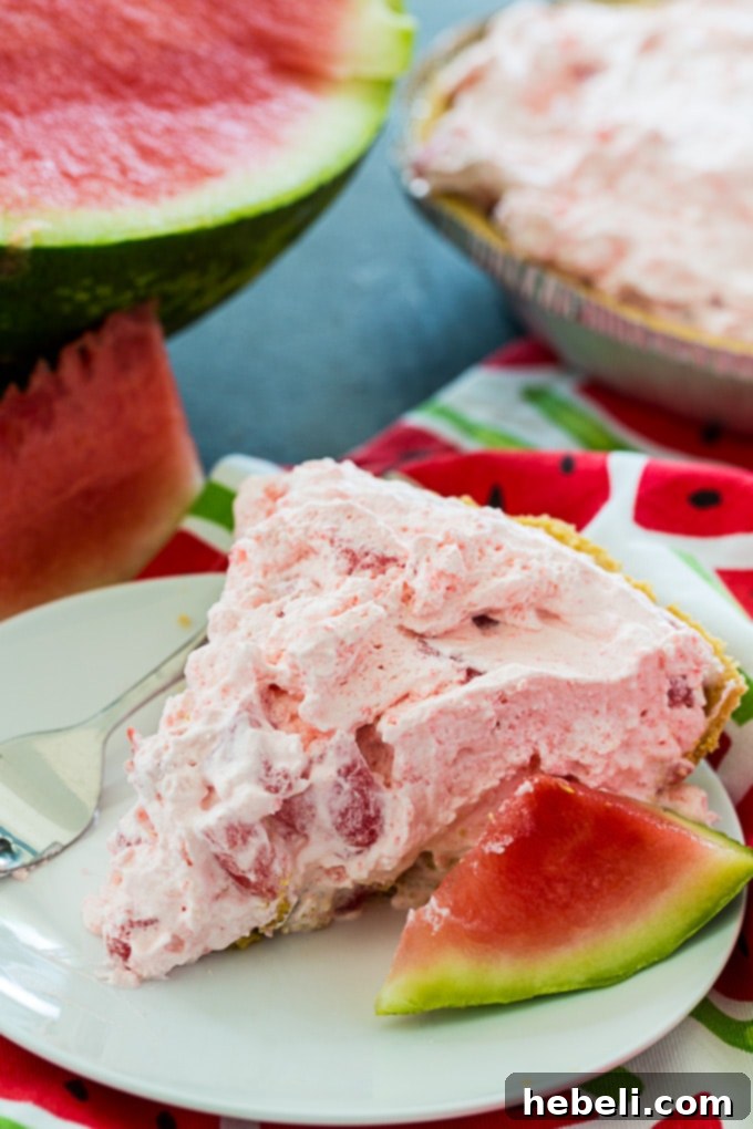 Close-up of No-Bake Watermelon Pie slice on a plate.