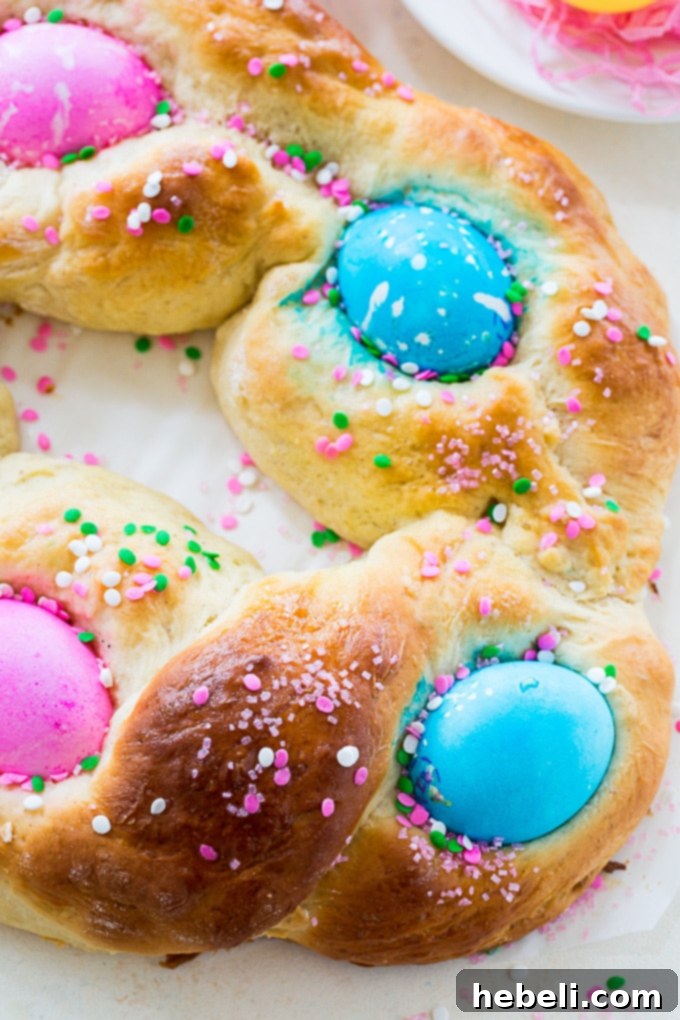 Festive Easter Loaf 3 Close-up of baked Easter Egg Bread, showcasing its beautiful texture and the vibrant dyed eggs nestled within.